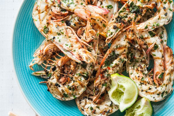 Asian style barbecued prawns halved in their shell & served with coriander, chilli & lime